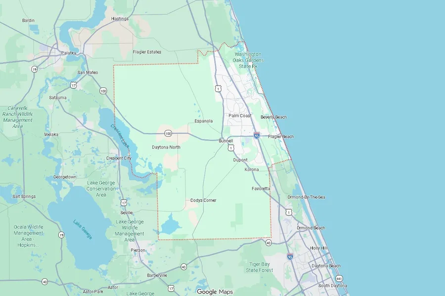 Road map of Flagler County, Florida, outlined against its neighbours: Palm Coast and the Atlantic beaches on the east, Bunnell and the rural west, with Crescent Lake and the St. Johns beyond